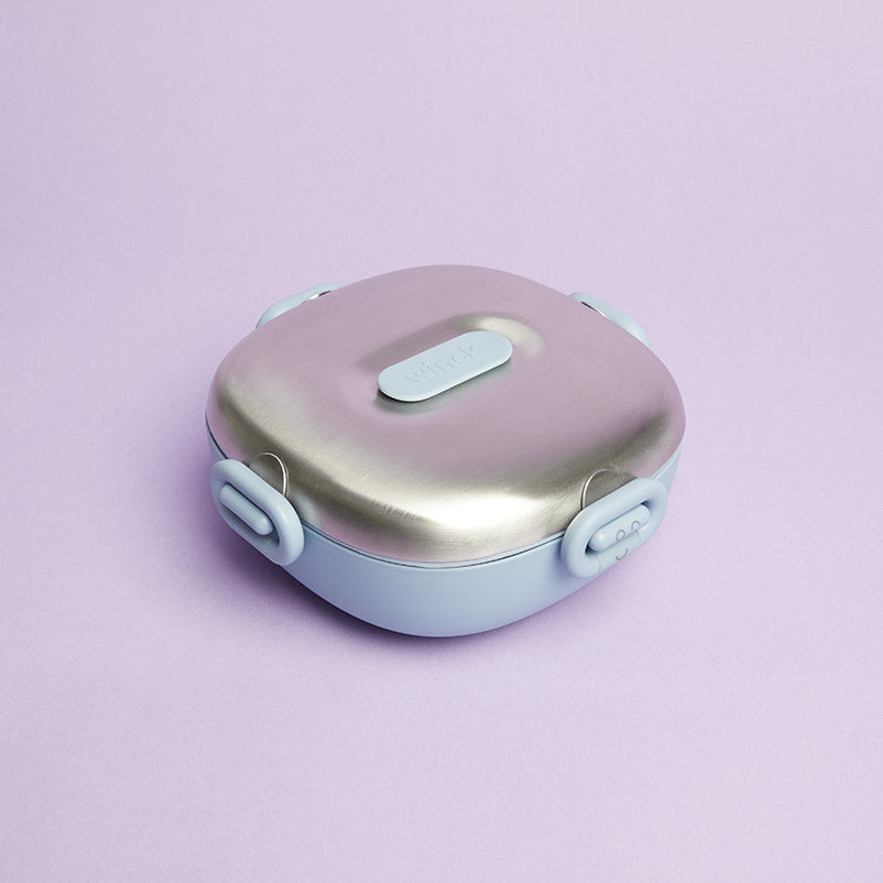 Winck Stainless Steel Bento Lunch Box with secure latches on a pastel purple background, designed for durability and style in Berry (colorway). Ideal for kids' healthy lunches.
