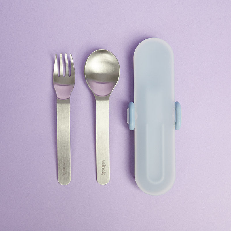 Winck stainless steel fork and spoon utensil set with a carrying case in Berry, laid out on a complementary purple background, ideal for kids' on-the-go dining needs.